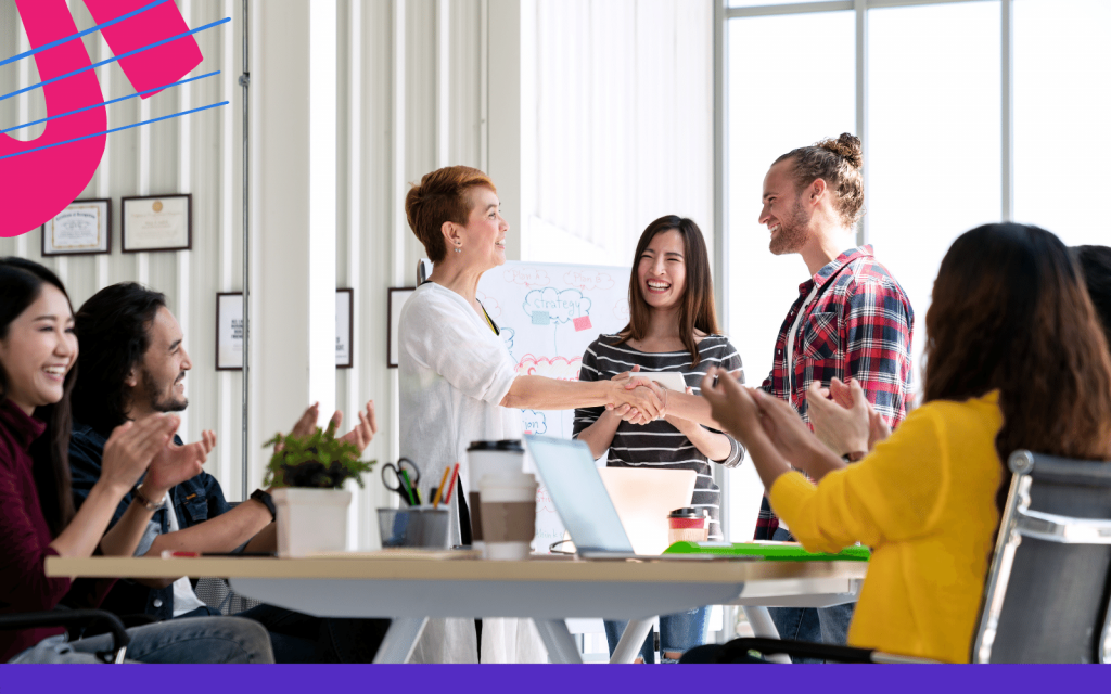 Smiling employees in a meeting room